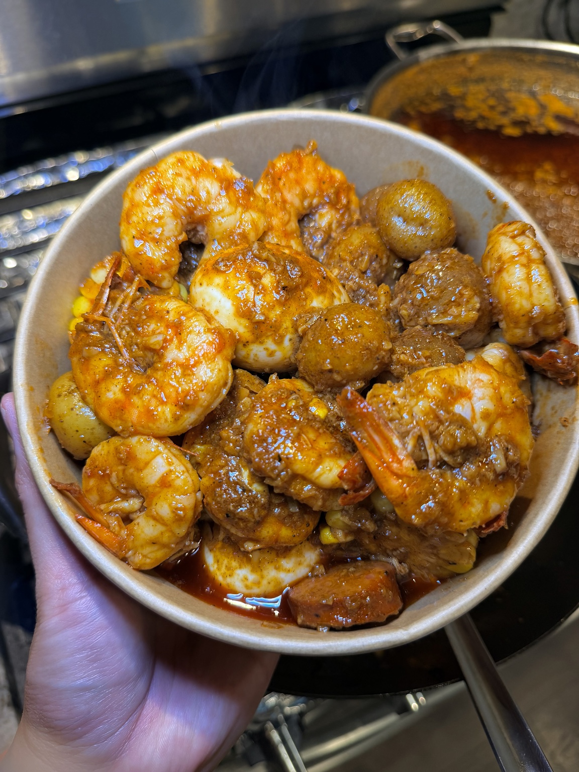 Cajun shrimp bowl with potatoes and sausage